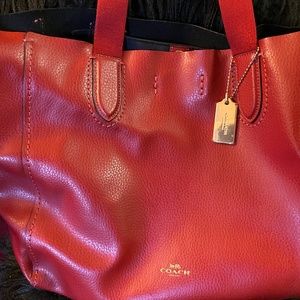 in perfectly liked new condition red coach shoulder bag